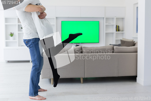 Image of couple hugging in their new home