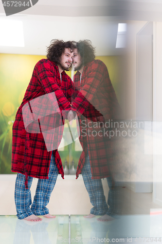 Image of portrait of young man in bathrobe