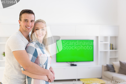 Image of couple hugging in their new home