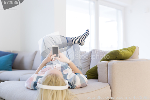 Image of girl enjoying music through headphones