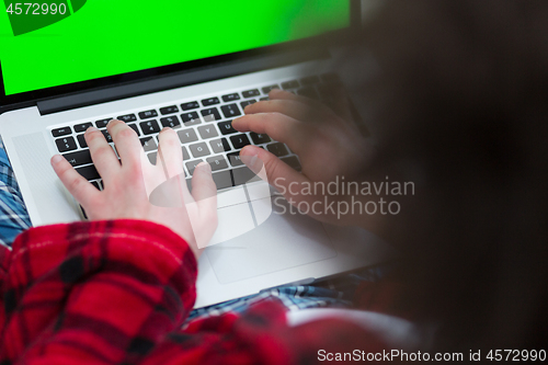 Image of man freelancer in bathrobe working from home
