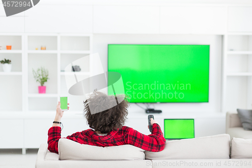 Image of young man in bathrobe enjoying free time