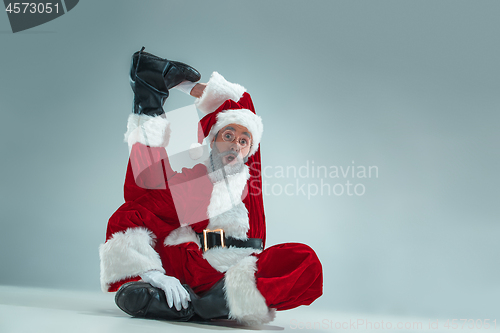 Image of Funny guy in christmas hat. New Year Holiday. Christmas, x-mas, winter, gifts concept.