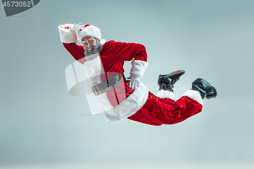 Image of Funny guy in christmas hat. New Year Holiday. Christmas, x-mas, winter, gifts concept.