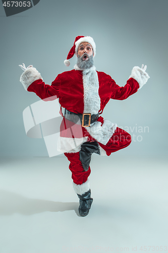 Image of Funny guy in christmas hat. New Year Holiday. Christmas, x-mas, winter, gifts concept.