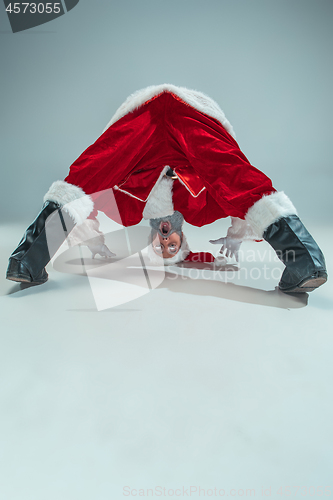 Image of Funny guy in christmas hat. New Year Holiday. Christmas, x-mas, winter, gifts concept.