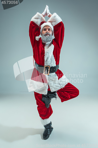 Image of Funny guy in christmas hat. New Year Holiday. Christmas, x-mas, winter, gifts concept.