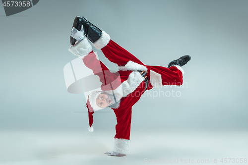 Image of Funny guy in christmas hat. New Year Holiday. Christmas, x-mas, winter, gifts concept.