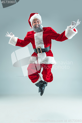 Image of Funny guy in christmas hat. New Year Holiday. Christmas, x-mas, winter, gifts concept.