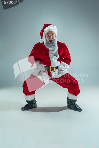 Image of Funny guy in christmas hat. New Year Holiday. Christmas, x-mas, winter, gifts concept.