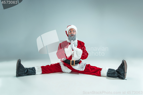 Image of Funny guy in christmas hat. New Year Holiday. Christmas, x-mas, winter, gifts concept.