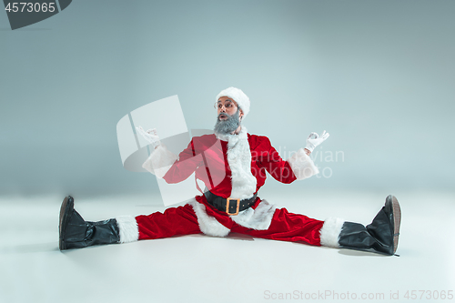 Image of Funny guy in christmas hat. New Year Holiday. Christmas, x-mas, winter, gifts concept.