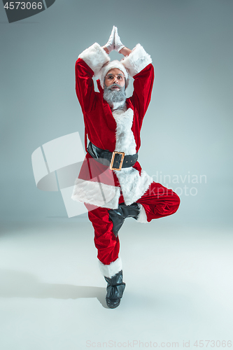 Image of Funny guy in christmas hat. New Year Holiday. Christmas, x-mas, winter, gifts concept.