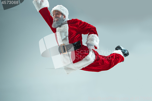 Image of Funny guy in christmas hat. New Year Holiday. Christmas, x-mas, winter, gifts concept.