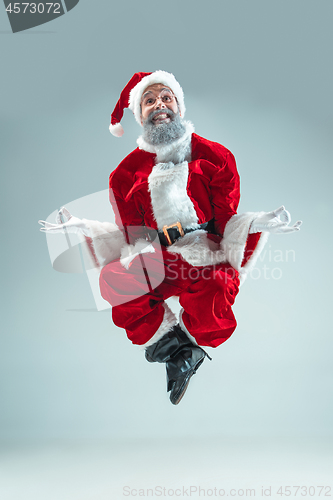 Image of Funny guy in christmas hat. New Year Holiday. Christmas, x-mas, winter, gifts concept.