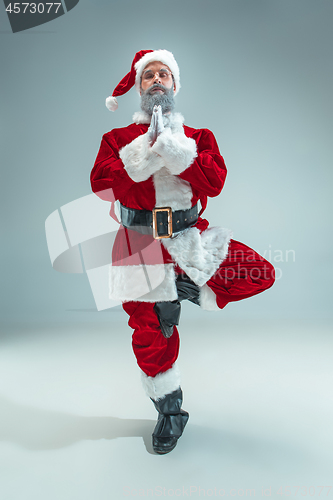 Image of Funny guy in christmas hat. New Year Holiday. Christmas, x-mas, winter, gifts concept.