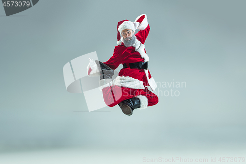 Image of Funny guy in christmas hat. New Year Holiday. Christmas, x-mas, winter, gifts concept.