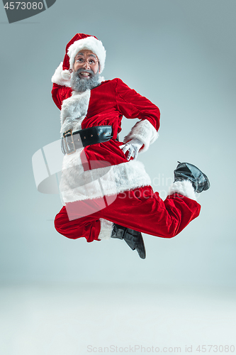 Image of Funny guy in christmas hat. New Year Holiday. Christmas, x-mas, winter, gifts concept.