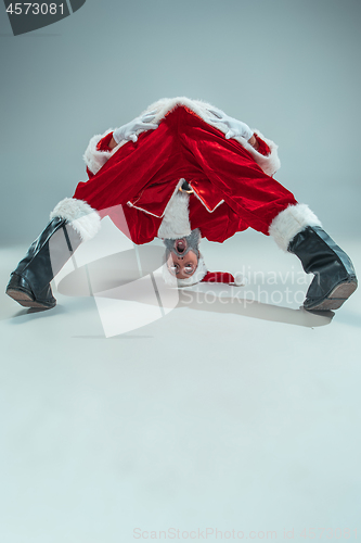 Image of Funny guy in christmas hat. New Year Holiday. Christmas, x-mas, winter, gifts concept.