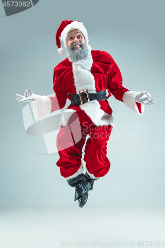 Image of Funny guy in christmas hat. New Year Holiday. Christmas, x-mas, winter, gifts concept.