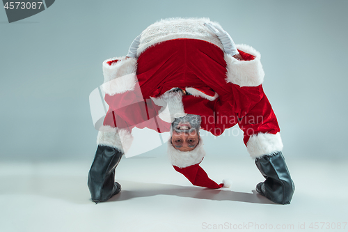 Image of Funny guy in christmas hat. New Year Holiday. Christmas, x-mas, winter, gifts concept.