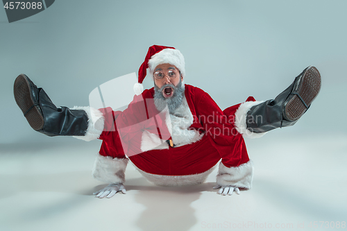 Image of Funny guy in christmas hat. New Year Holiday. Christmas, x-mas, winter, gifts concept.