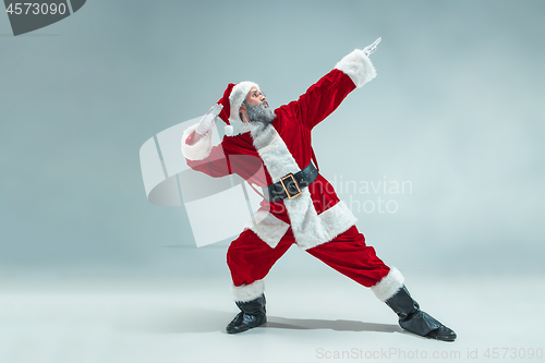 Image of Funny guy in christmas hat. New Year Holiday. Christmas, x-mas, winter, gifts concept.