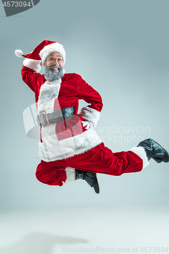 Image of Funny guy in christmas hat. New Year Holiday. Christmas, x-mas, winter, gifts concept.