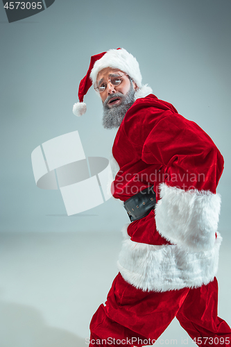 Image of Funny guy in christmas hat. New Year Holiday. Christmas, x-mas, winter, gifts concept.