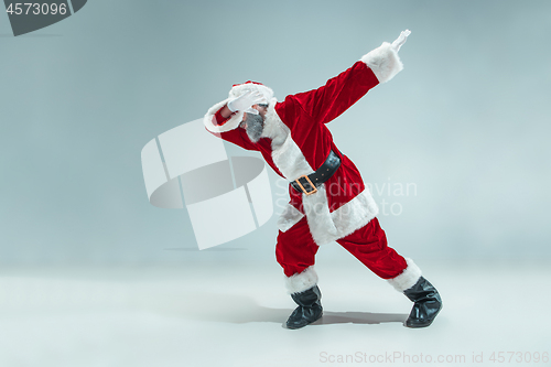 Image of Funny guy in christmas hat. New Year Holiday. Christmas, x-mas, winter, gifts concept.