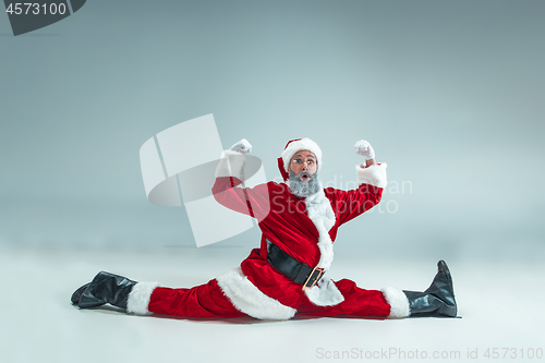 Image of Funny guy in christmas hat. New Year Holiday. Christmas, x-mas, winter, gifts concept.