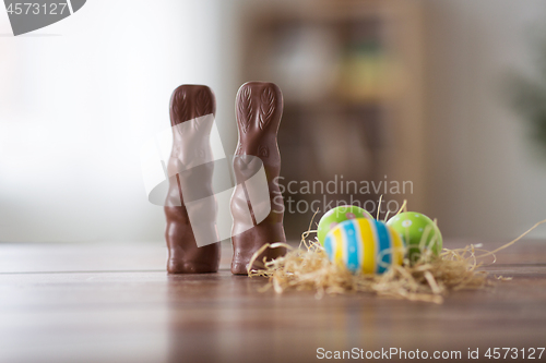 Image of easter eggs in straw nest and chocolate bunnies