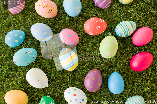 Image of colored easter eggs on artificial grass