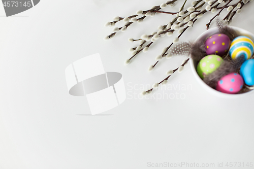 Image of colored easter eggs and pussy willow branches
