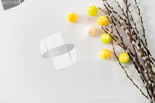 Image of pussy willow branches and easter egg candles