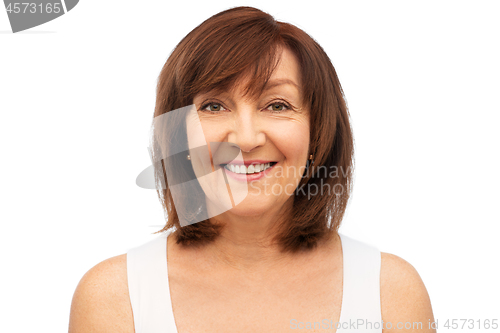 Image of portrait of smiling senior woman over white