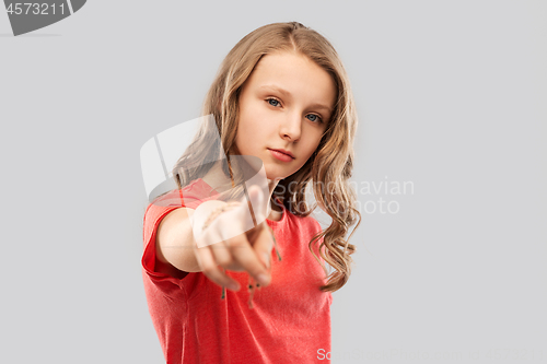 Image of teenage girl in red t-shirt pointing finger to you