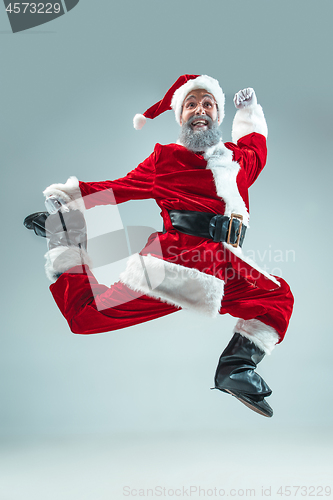 Image of Funny guy in christmas hat. New Year Holiday. Christmas, x-mas, winter, gifts concept.