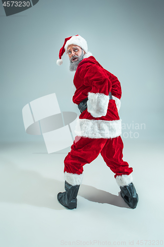 Image of Funny guy in christmas hat. New Year Holiday. Christmas, x-mas, winter, gifts concept.