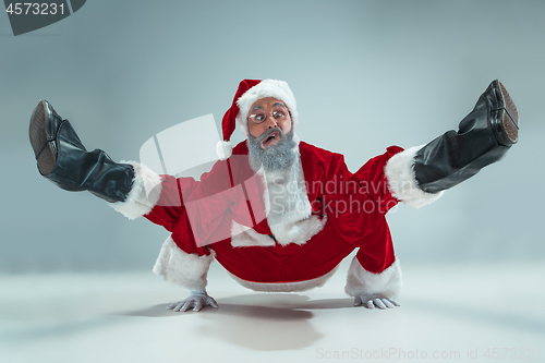 Image of Funny guy in christmas hat. New Year Holiday. Christmas, x-mas, winter, gifts concept.