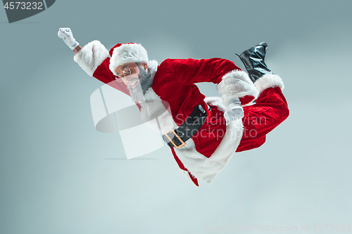 Image of Funny guy in christmas hat. New Year Holiday. Christmas, x-mas, winter, gifts concept.