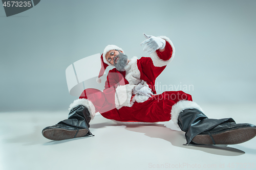 Image of Funny guy in christmas hat. New Year Holiday. Christmas, x-mas, winter, gifts concept.