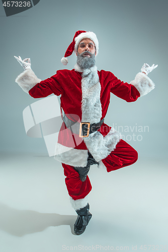 Image of Funny guy in christmas hat. New Year Holiday. Christmas, x-mas, winter, gifts concept.