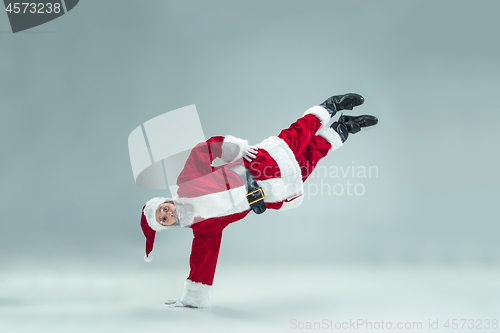 Image of Funny guy in christmas hat. New Year Holiday. Christmas, x-mas, winter, gifts concept.