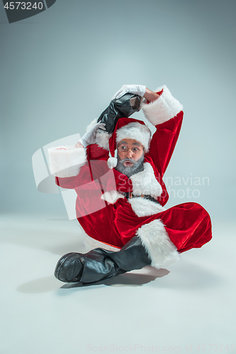 Image of Funny guy in christmas hat. New Year Holiday. Christmas, x-mas, winter, gifts concept.