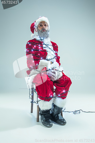 Image of Funny guy in christmas hat. New Year Holiday. Christmas, x-mas, winter, gifts concept.