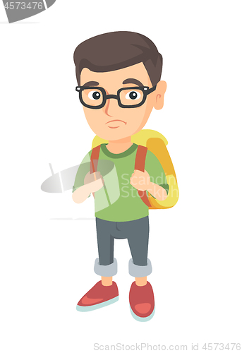 Image of Little caucasian sad schoolboy carrying a backpack