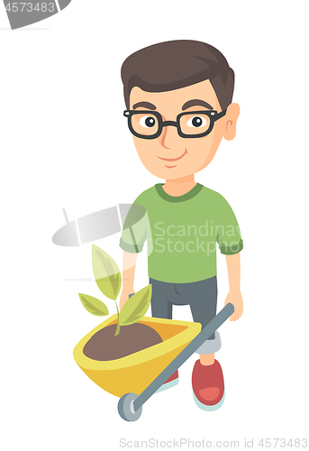 Image of Boy pushing wheelbarrow with soil and plant.