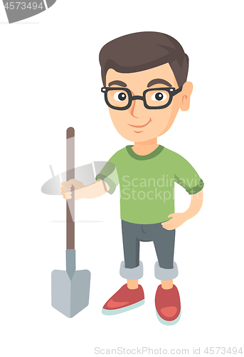 Image of Caucasian smiling boy in glasses holding a shovel.