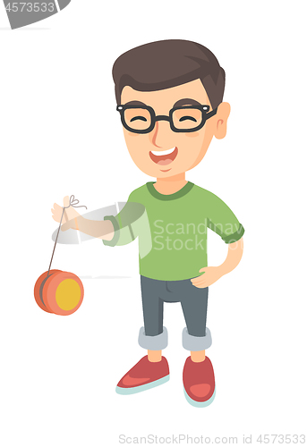Image of Caucasian boy in glasses playing with yo-yo.
